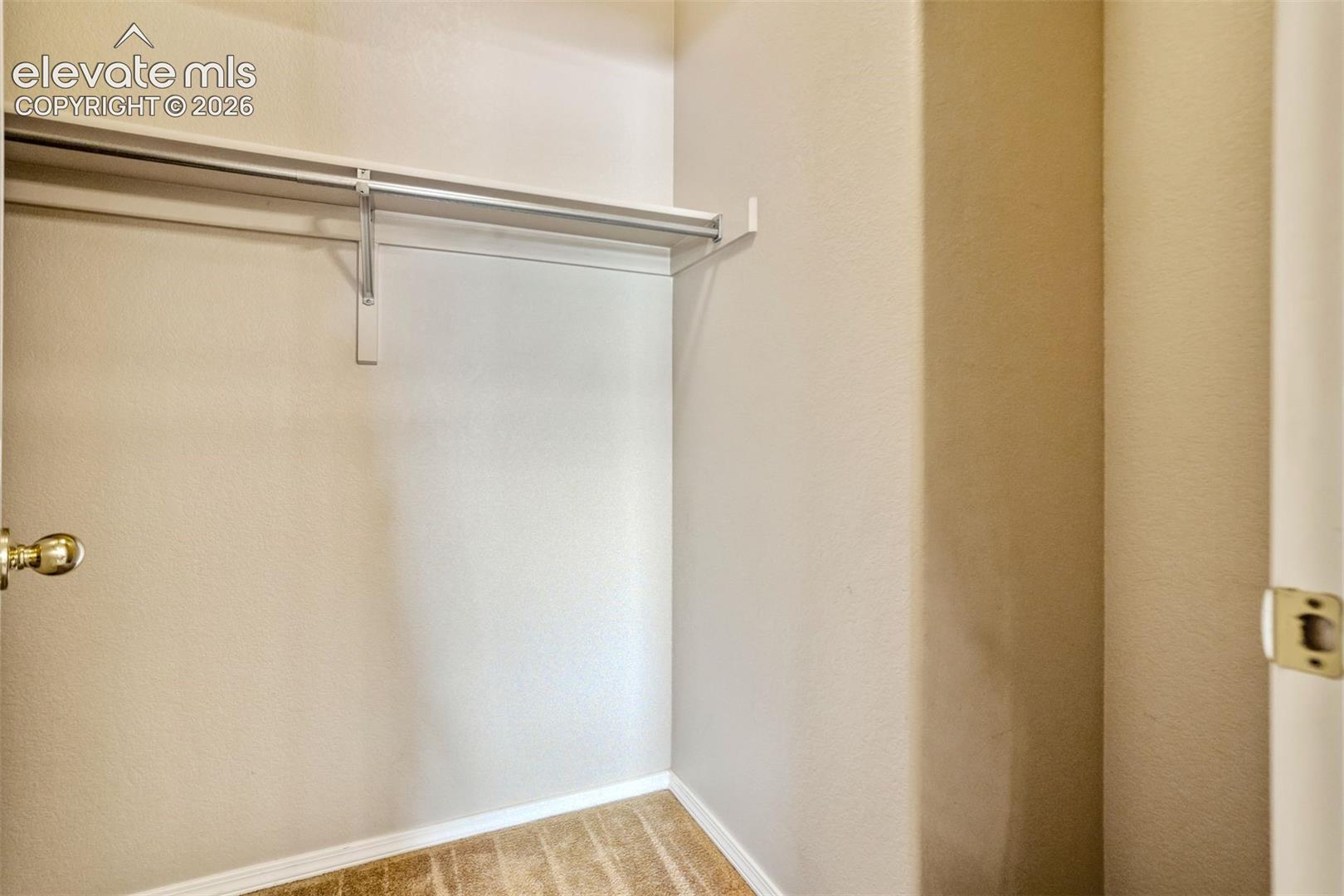 Walk-in Closet attached to Primary Bathroom