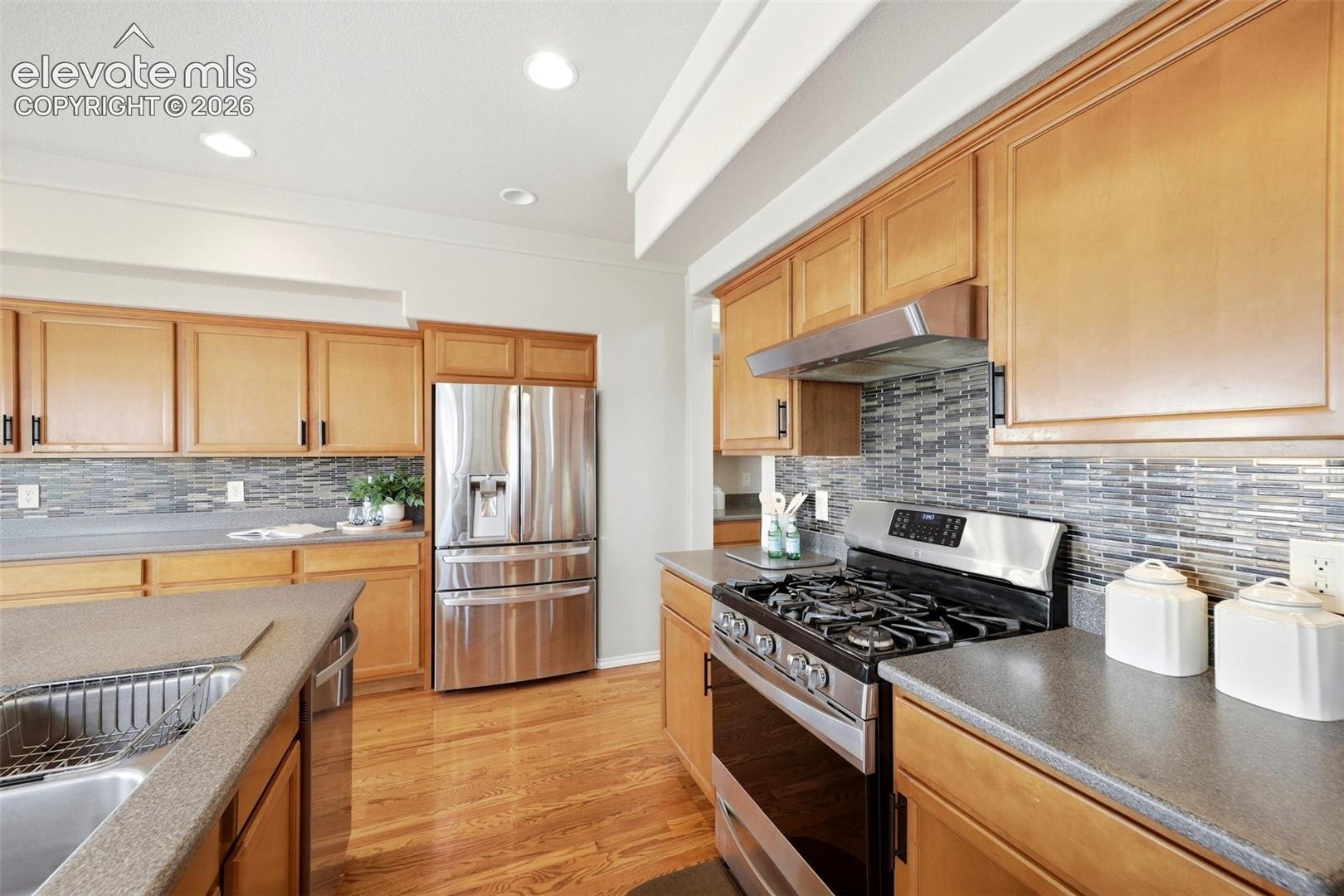 Eat in Kitchen with SS appliances, butlers pantry and hard wood flooring