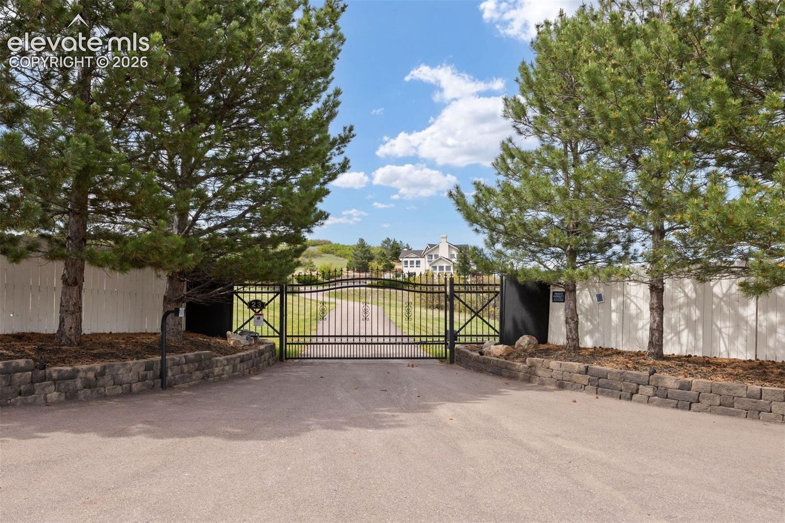 Privately gated and tucked at the end of a shared private road, just minutes from the shops, restaurants, and charm of downtown Castle Rock, this residence offers the seclusion you crave without the compromise.