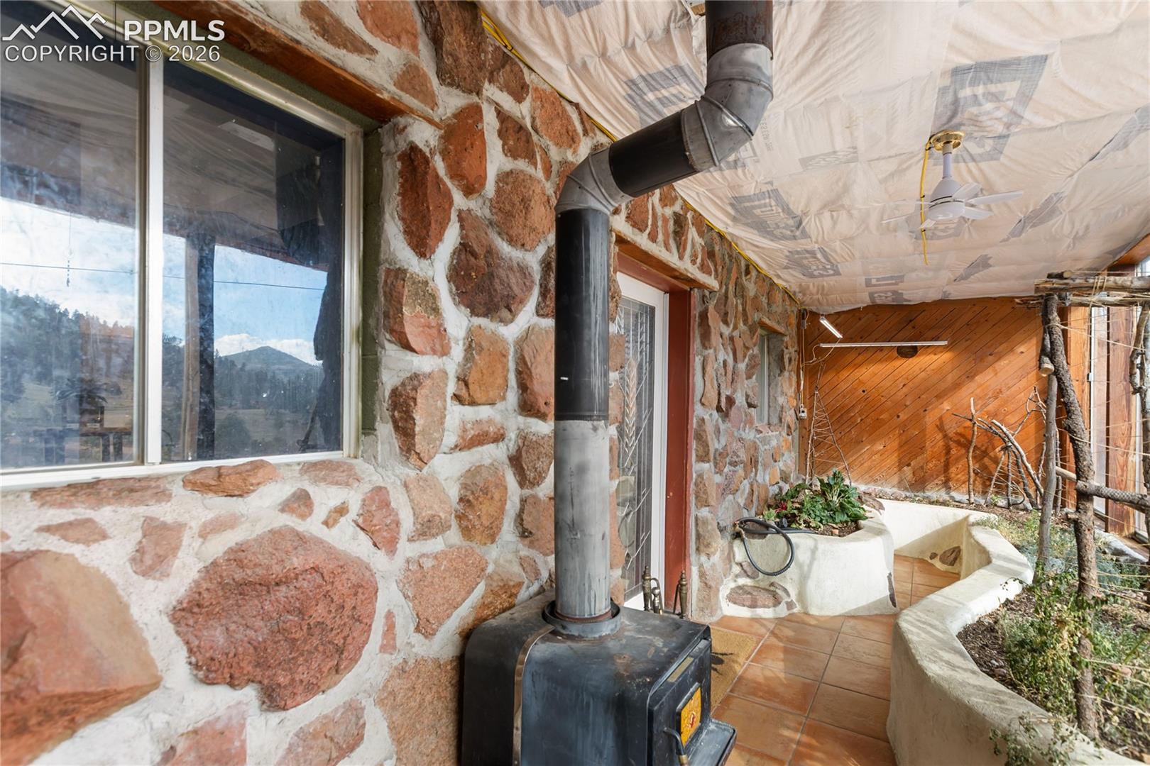 Garden sunroom and wood burning fireplace