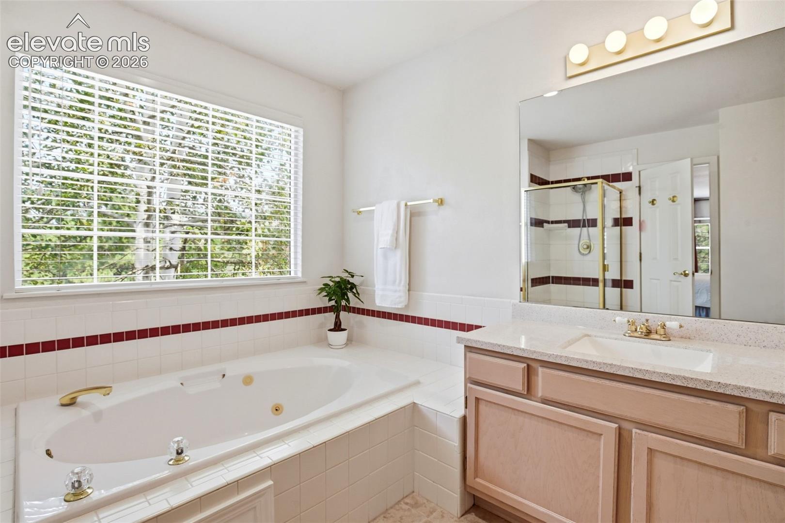 Primary bath has dual vanities.