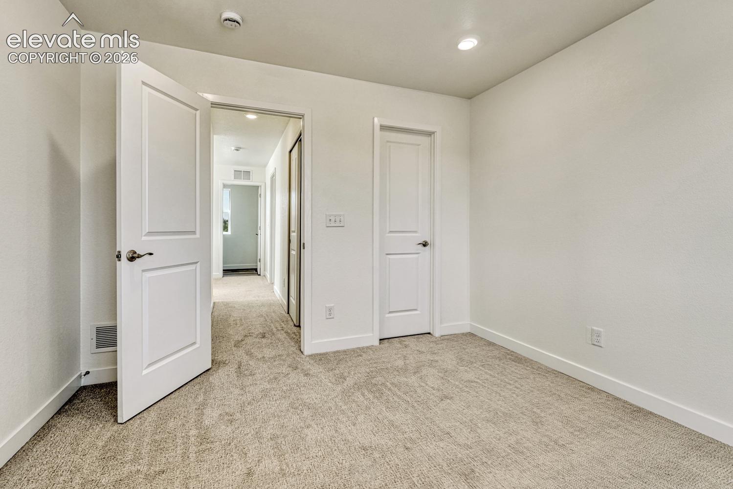 Secondary bedroom with walk-in closet