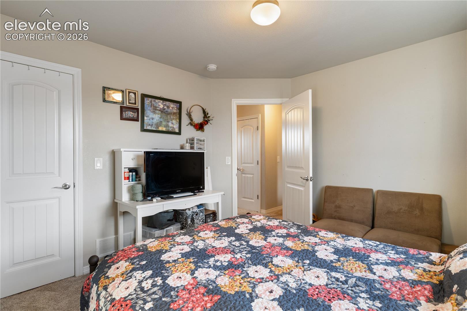 both secondary closets feature walk in closets and overlook back yard