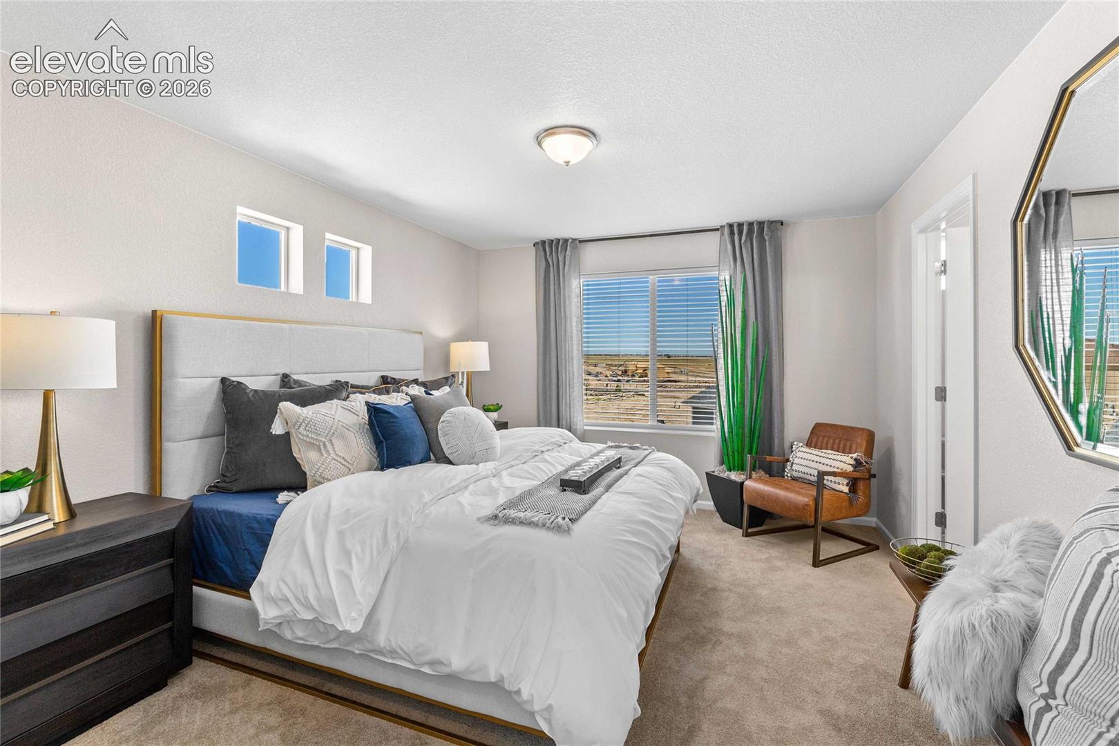 Recessed window niches with dual fixed windows, wide window with blinds, soft carpet flooring, and a flush mount ceiling light
*photos of a model home*