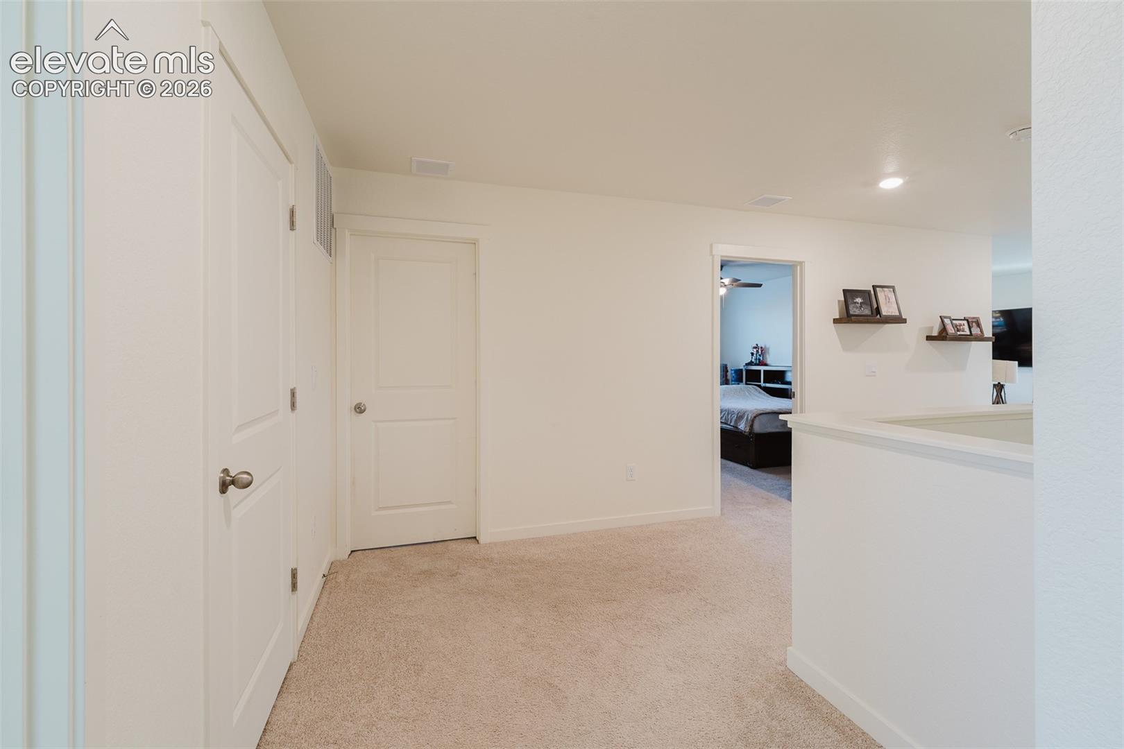 Hallway to upper level secondary bedrooms.