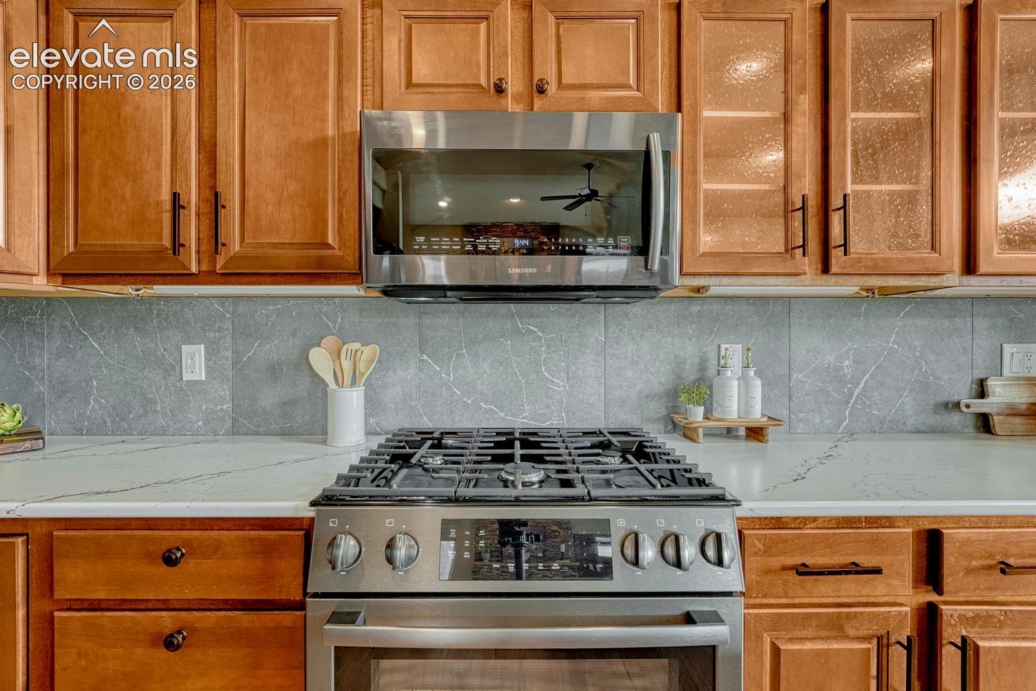 The Kitchen offers a Bosch gas range oven and built-in microwave oven.