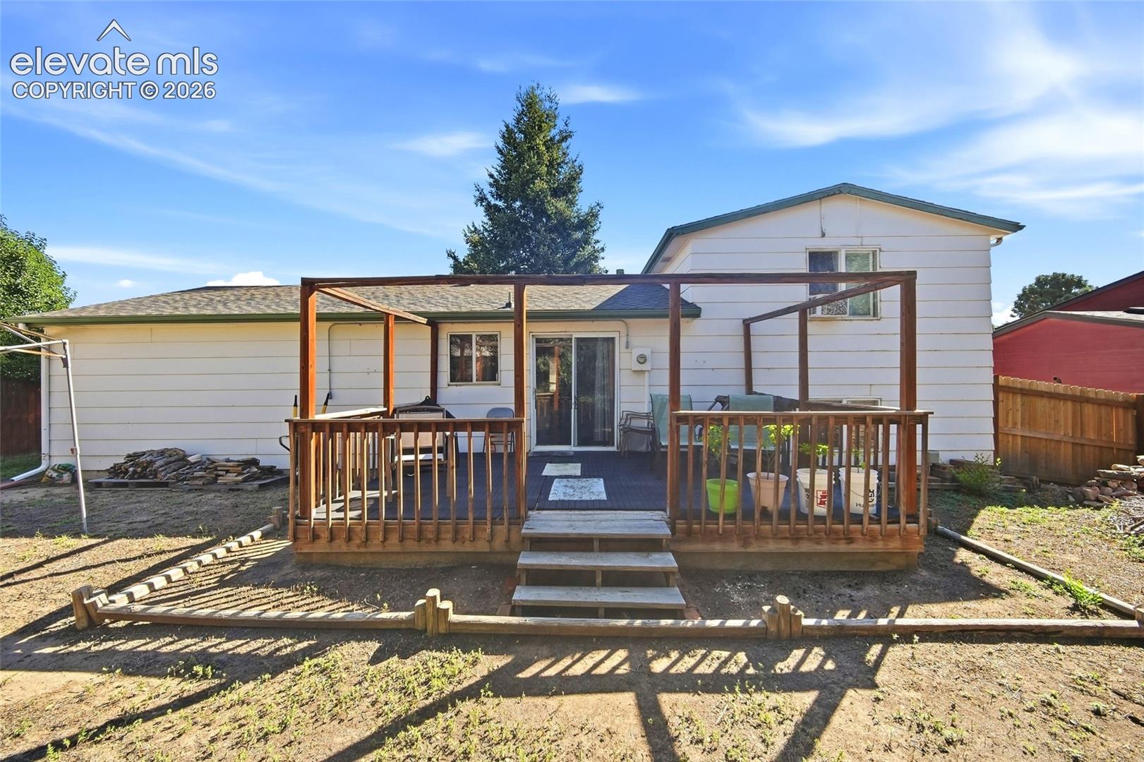Rear yard showing large wooden deck