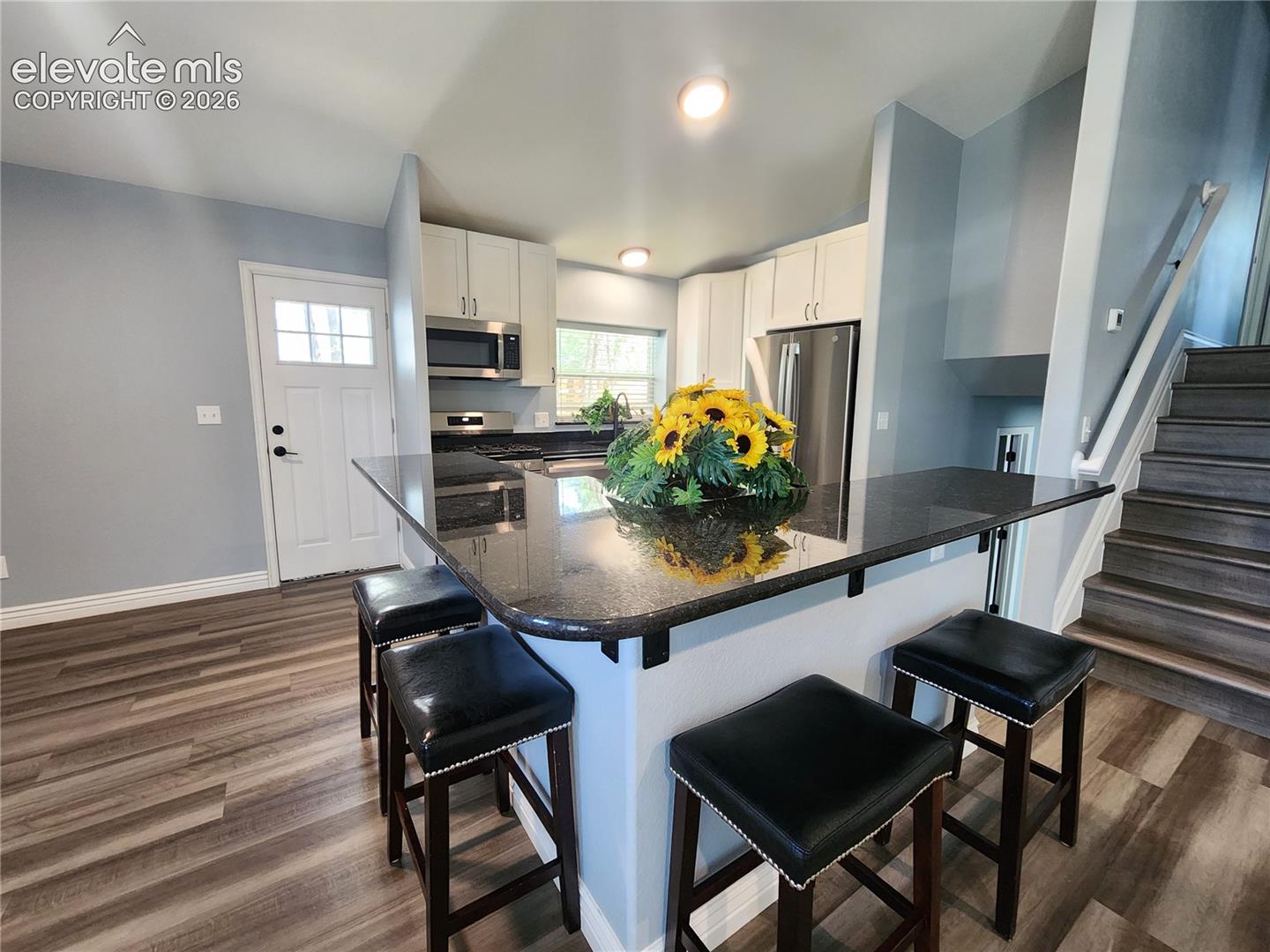 Cozy breakfast bar area ideal for morning coffee or quick meals