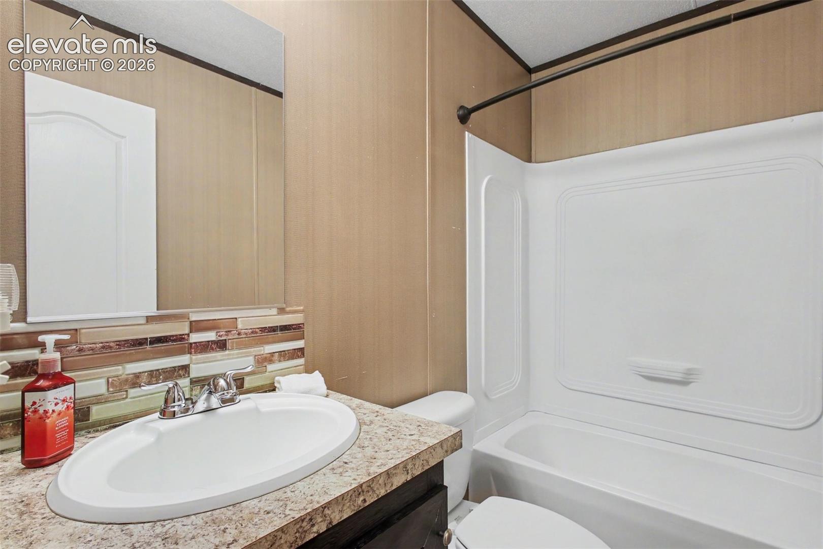 2nd Home: Clean and functional bathroom offering convenience for family and guests.