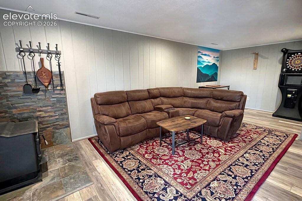 Cozy family room with wood burning stove. Walk out, garage entrance and laundry