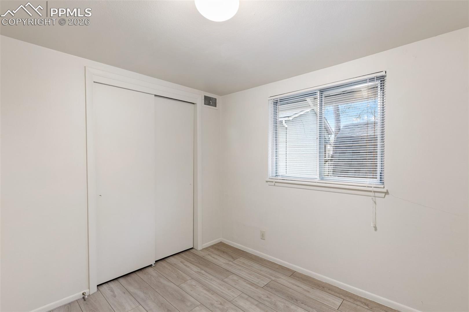 One of 2 bedrooms - featuring LVP flooring.