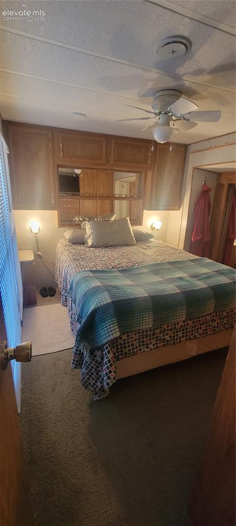 Built-in wood-finish cabinetry, integrated mirrors, and wall-mounted lighting