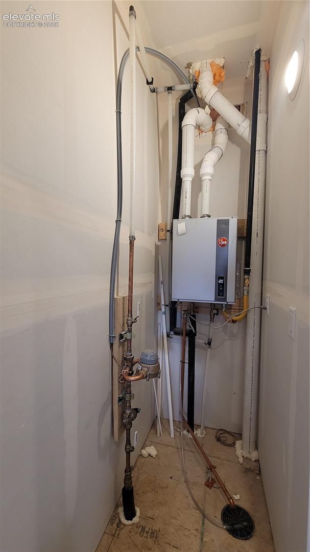 Utility closet on entry level with a tankless water heater! 