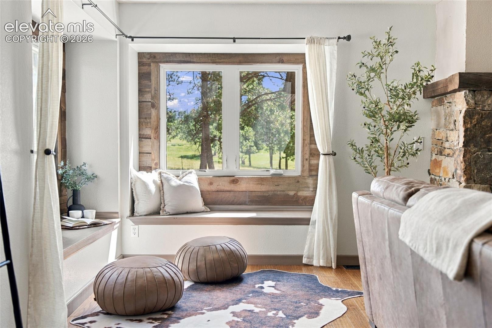 Window seat with wood-finish trim and accent wall