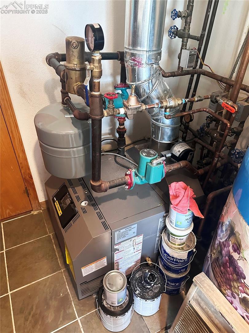 This shows the very new boiler and pump for the under floor hot water radiant heating system.  Very efficient and clean heating with no blowers or forced air.