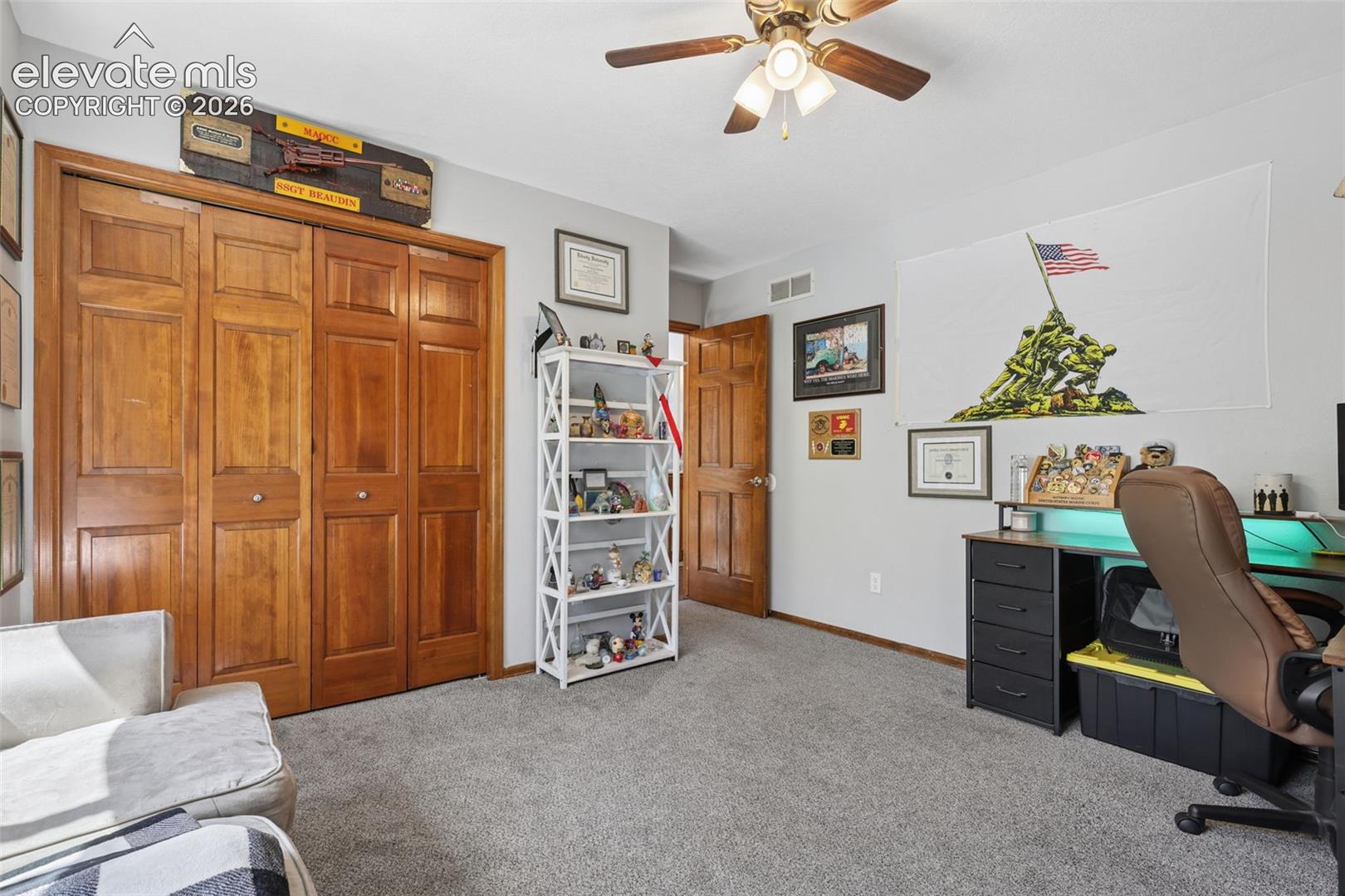 Soft gray carpeting and light gray wall paint create a neutral palette