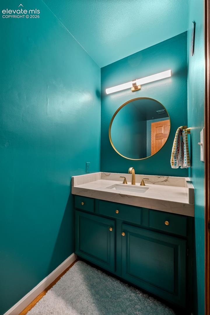 Vanity with integrated sink and stone countertop