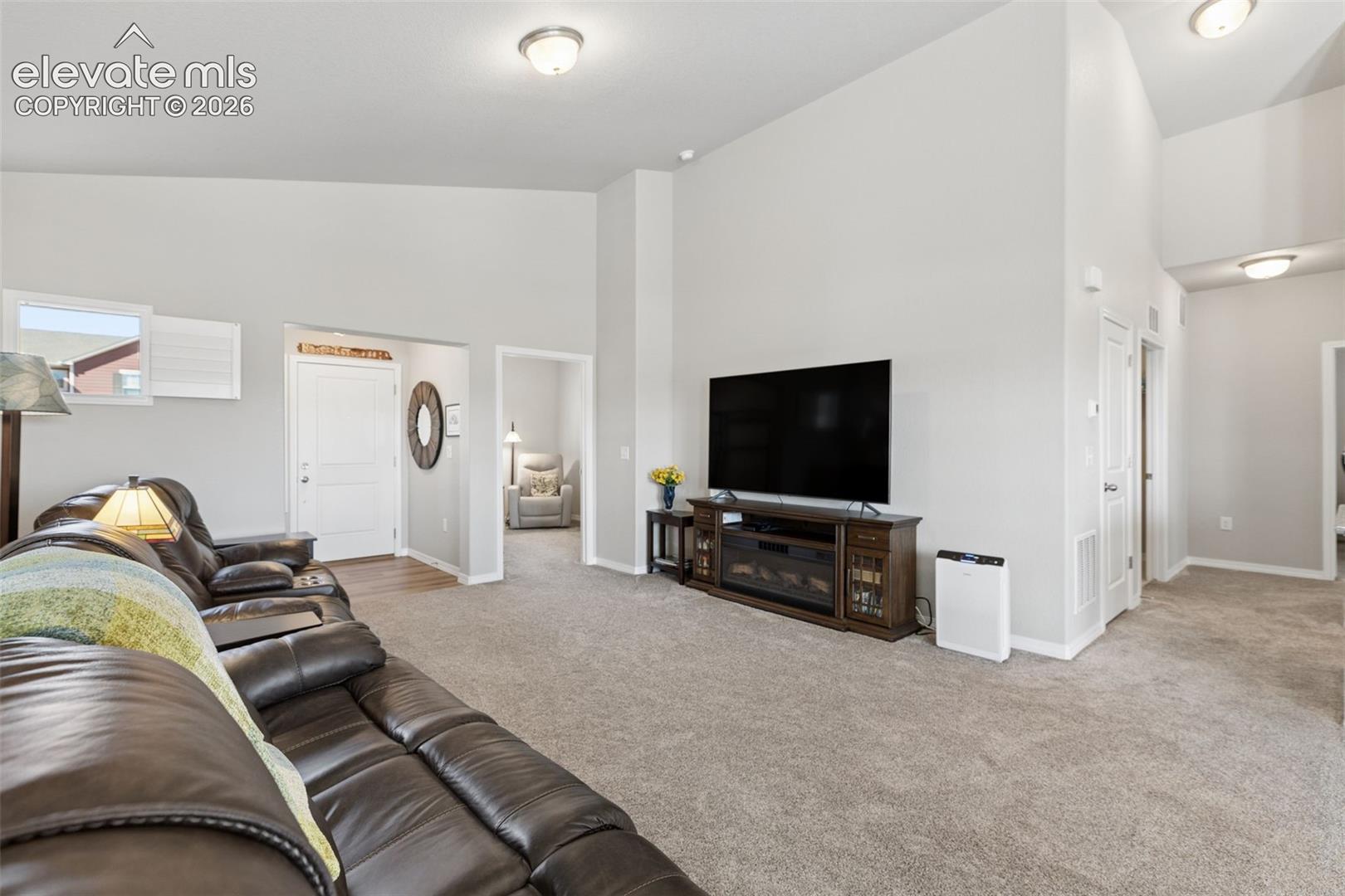 View from dining room to living room and front door.