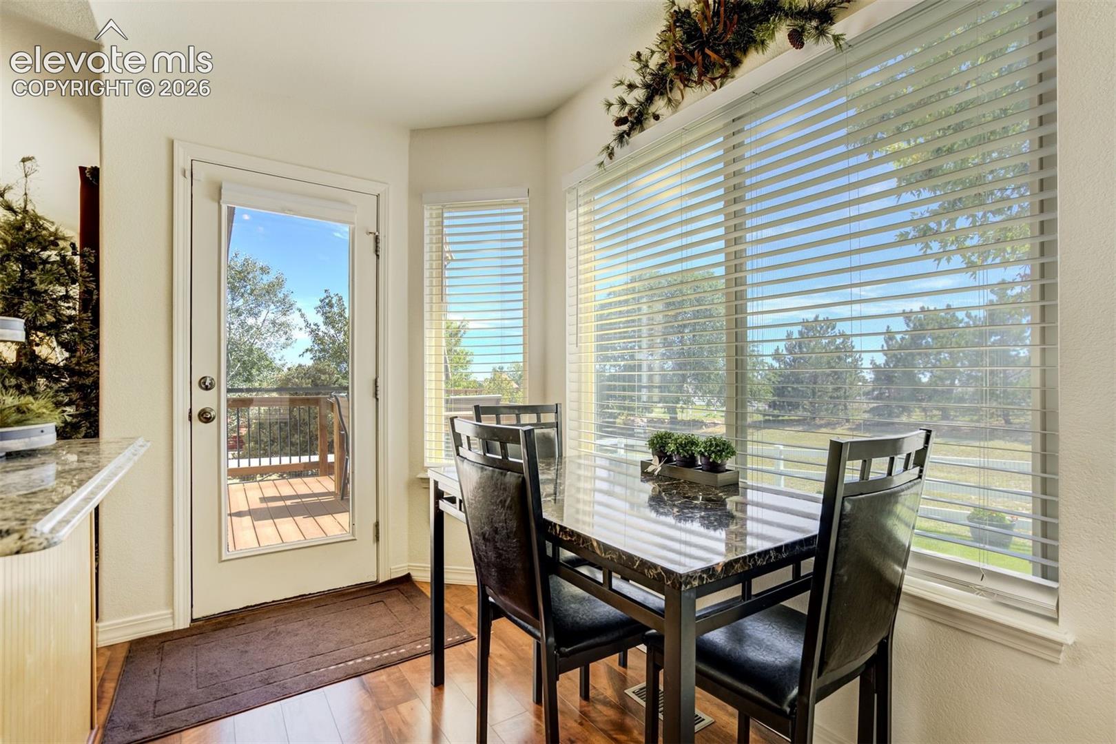 Dining area in kitchen with walkout to composite deck and private backyard