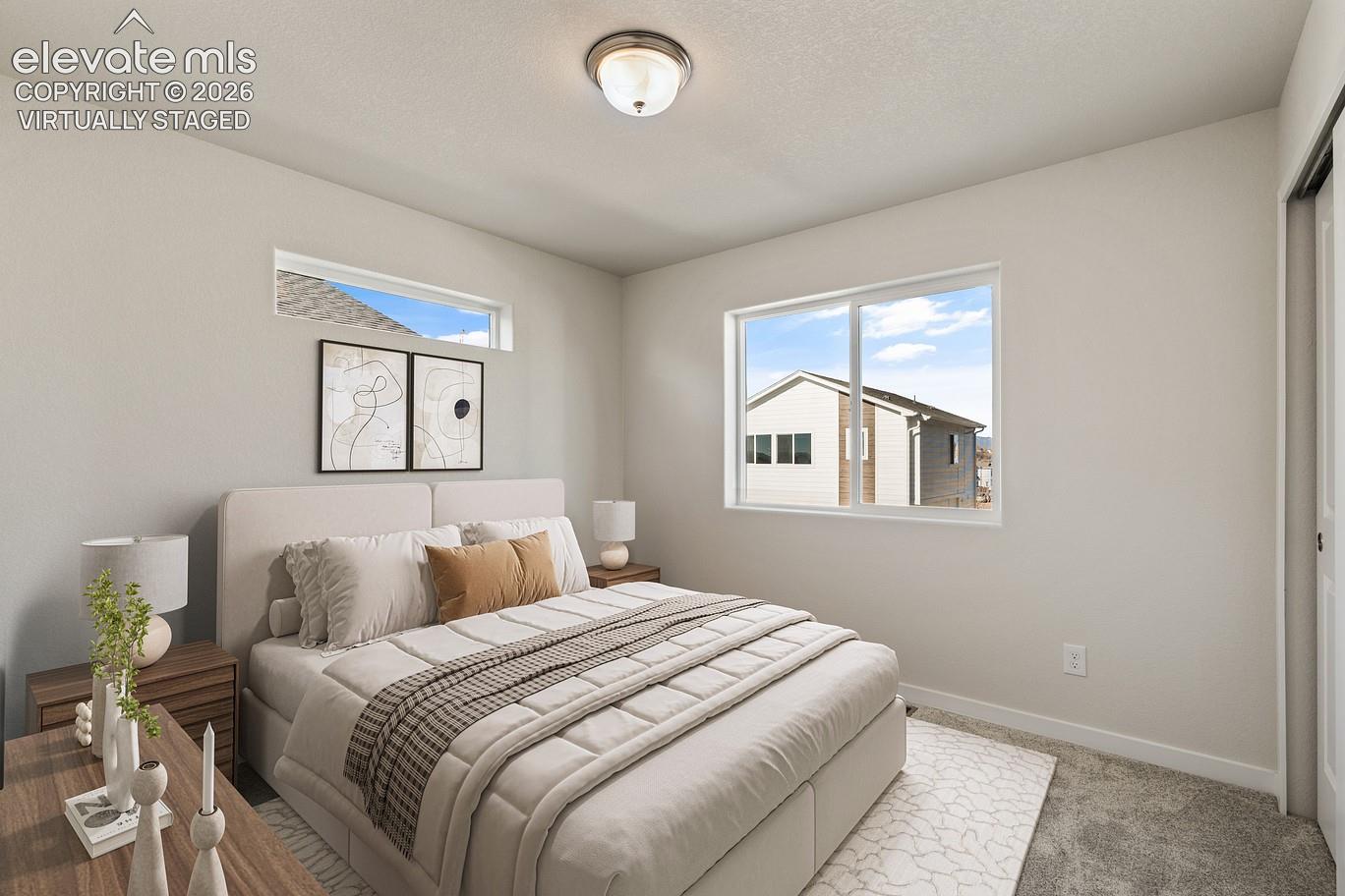 bedroom with high horizontal clerestory window and large side window, neutral walls and ceiling light — virtually staged