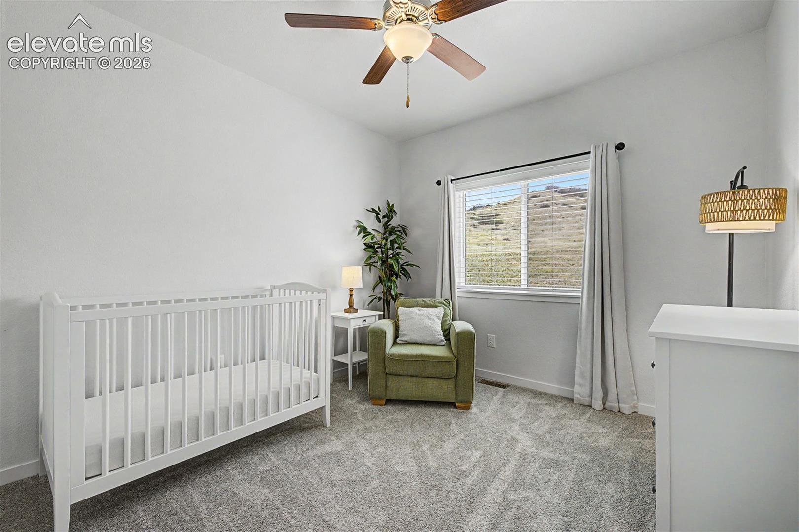 The tranquil simplicity shines through while a window filled with natural hill views create a space that feels both nurturing and beautifully designed from day one.