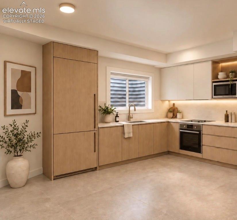  Virtually Staged CONCEPT ONLY- for a much requested 2nd kitchen option in lower level. The actual utility area is unfinished, but has water, drains, gas & electric access to add a kitchen area for Multi gen spaces.  A kitchenette/coffee bar area could be place in alcove at the bottom of the stairs alternatively. 