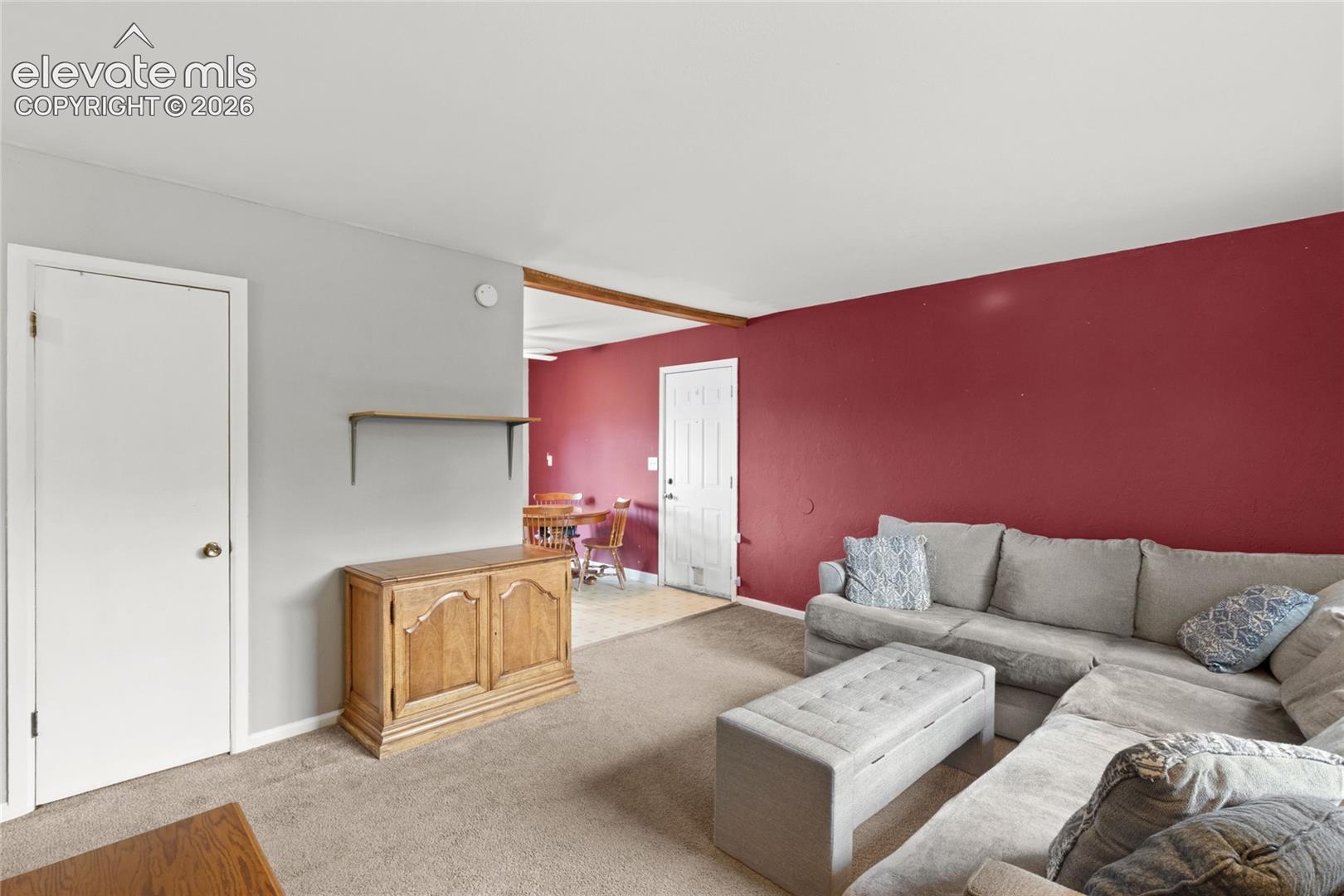 Living room with plenty natural light through new front windows
