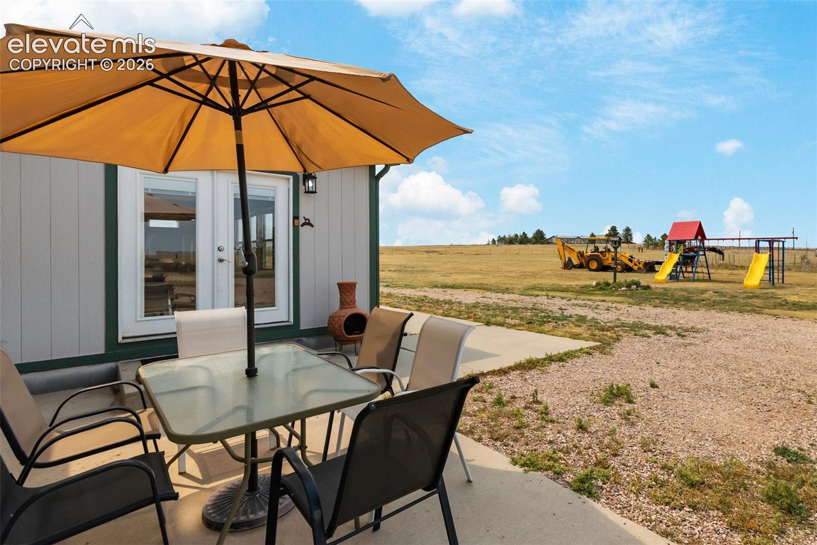 Concrete patio area featuring direct outdoor access