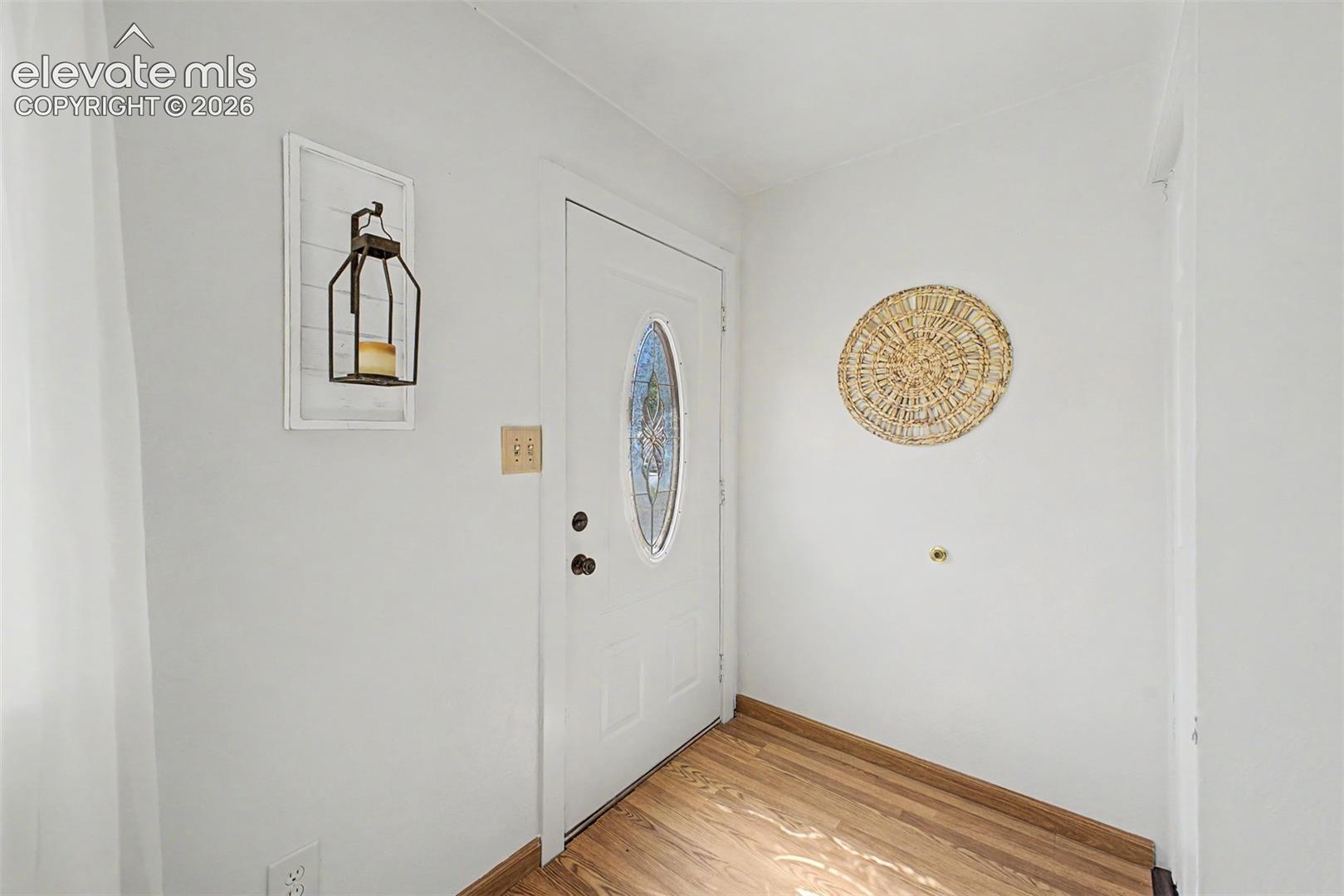 White entry door with decorative glass insert welcome you home