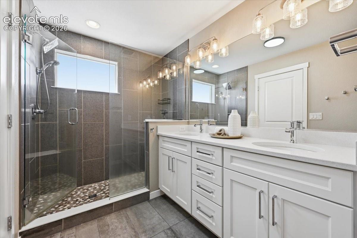 Spacious master bath with double vanity and white cabinets!