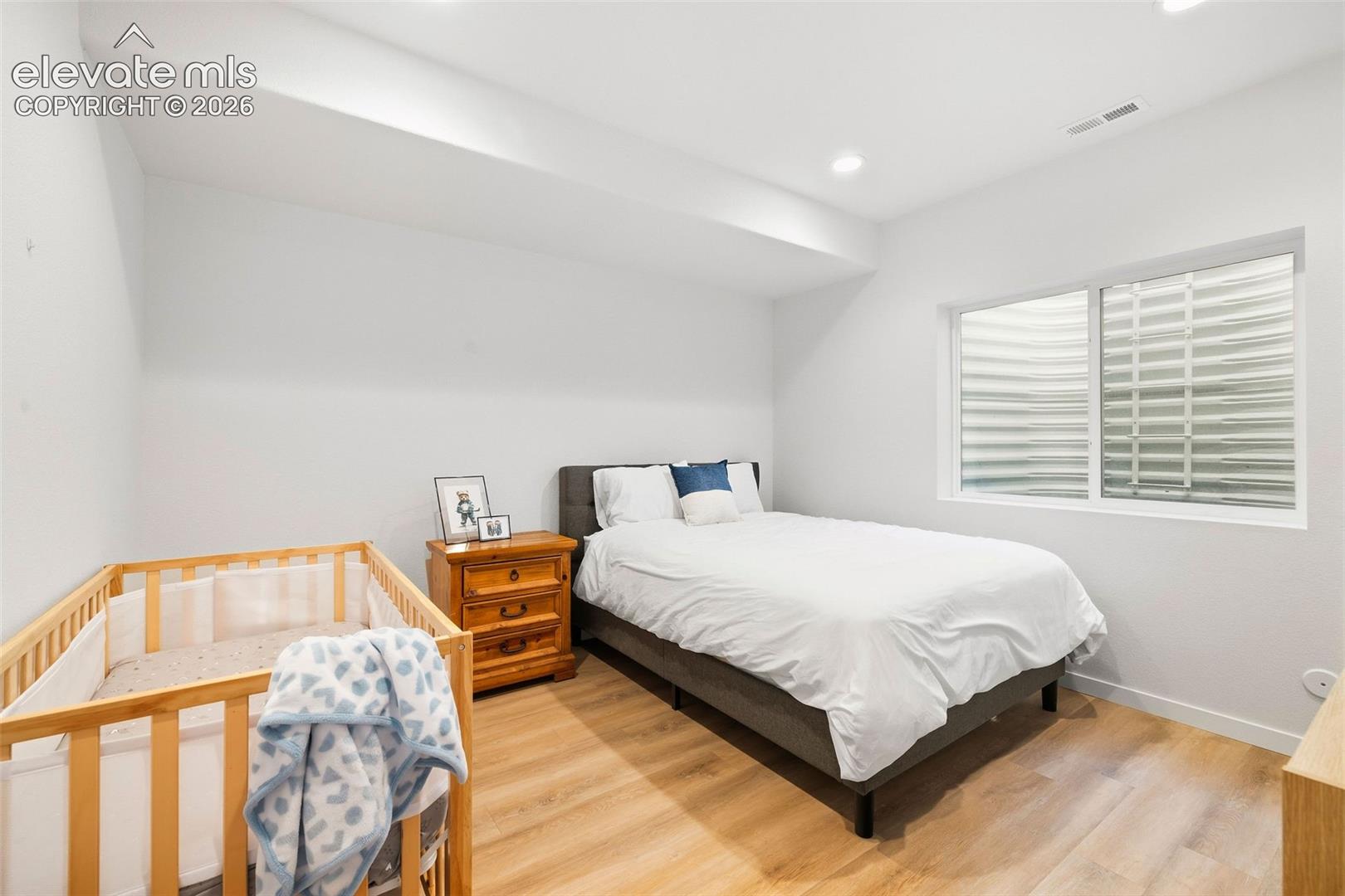 The third bedroom on the lower level is perfect for the light sleeper who needs things on the darker side. This also makes a great office or guest room. 