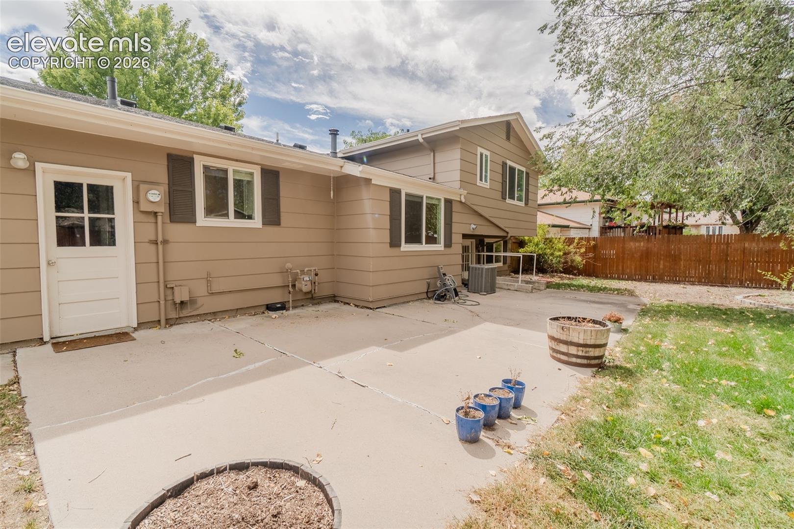 Expansive concrete patio with direct outdoor access