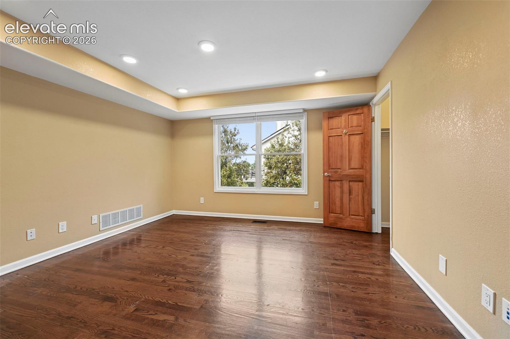 Unstaged office tucked behind double doors could be a perfect main floor bedroom!  