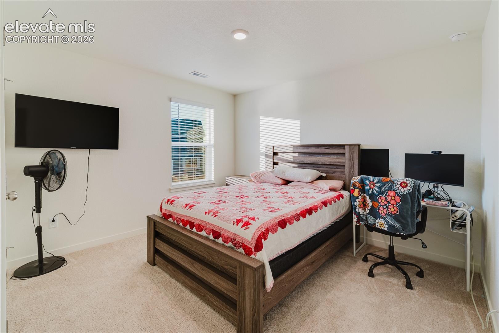 Upper Level Bedroom #4 with neutral carpet.