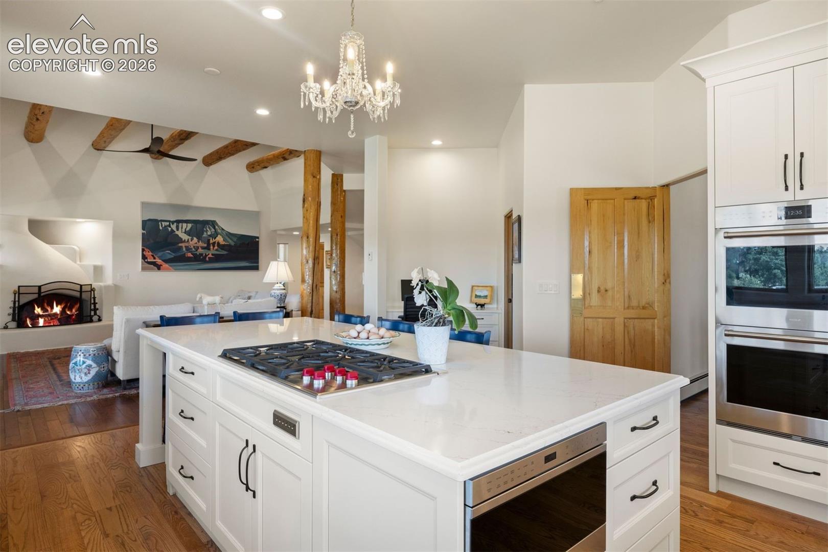 The kitchen is spacious with large center island with seating, walk-in pantry, and planning desk.