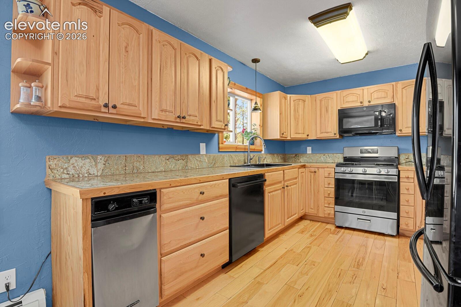 Kitchen features new stainless steel appliances