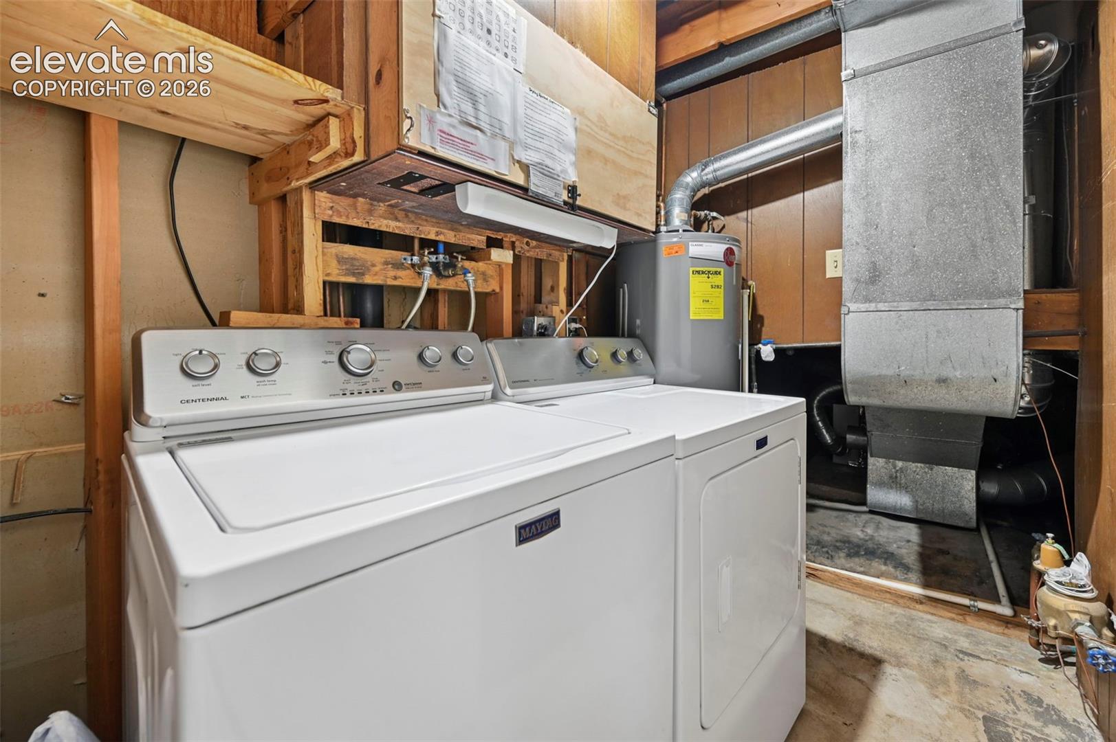 Dedicated laundry area featuring a washer and dryer