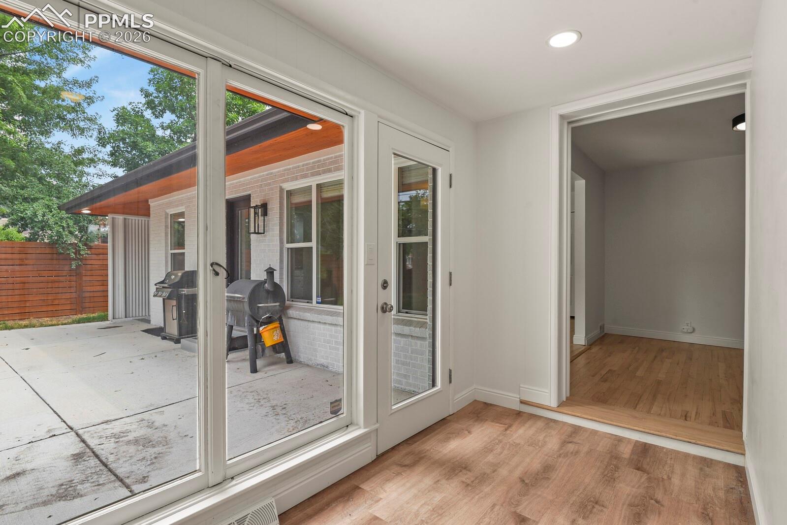 Sunroom area with a door leading to the private back patio