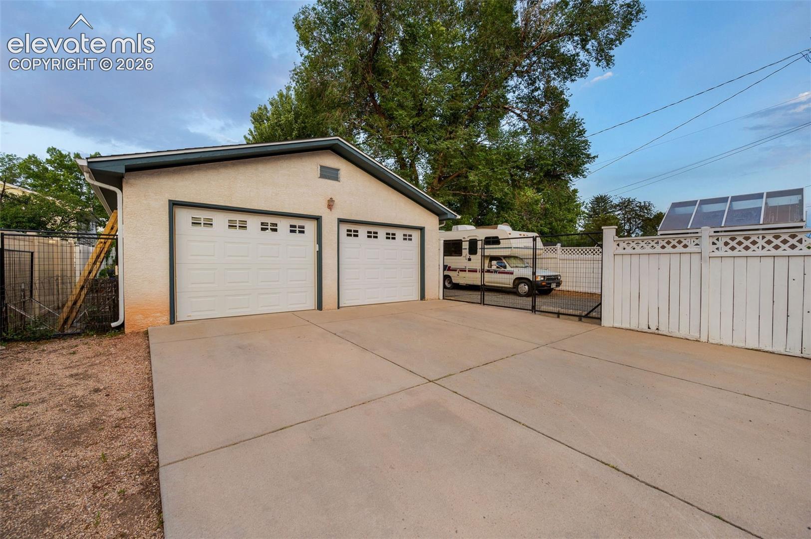 Huge 2 car garage with storage, workbench, and skylight