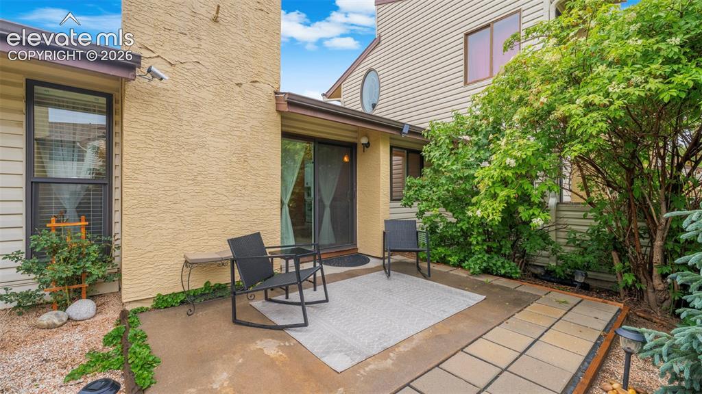 Private patio featuring a sliding glass door entry