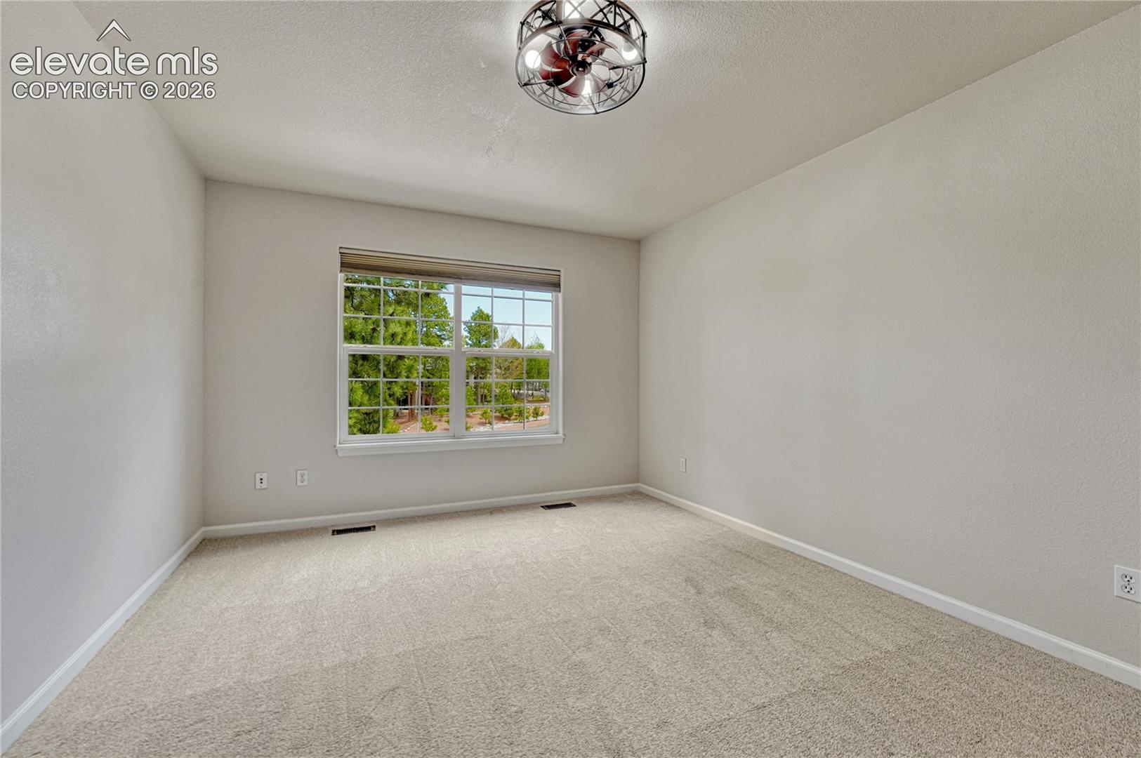 Second of two additional upstairs bedrooms. 