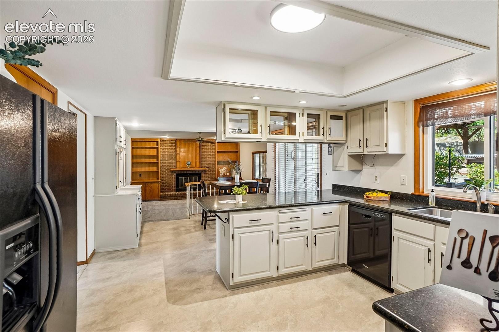 Kitchen opens to eat-in area with walk-out to deck.