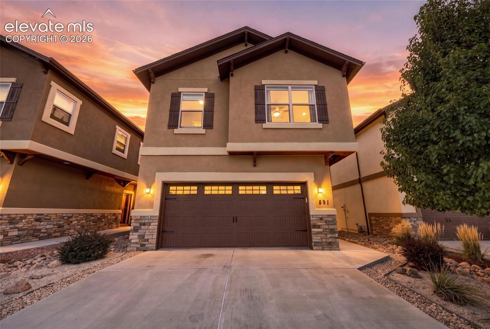 This home did its homework. Solar: fully owned. Schools: Cheyenne Mountain D-12. Finishes: thoughtfully chosen. Welcome to 891 Redemption Point, a 4-bedroom, 3.5-bath home built in 2018, tucked on a quiet cul-de-sac, that graduates at the top of its class. Picture yourself curled up by the gas fireplace on crisp Colorado evenings, crown molding overhead, wood-look tile underfoot and the kitchen just steps away, with quartz counters, white shaker cabinetry, matching GE stainless, under-cabinet lighting and a generous island where everyone ends up gathering. Step onto the main-level deck, made for slow mornings and your first cup of coffee. Upstairs, the primary suite is a true retreat, with a walk-in closet, double vanity, private water closet and an oversized tiled shower with bench seating and a rain showerhead. The guest bath has its own double vanity, and laundry sits on the bedroom level, exactly where it belongs. Below, the finished walkout basement offers a second living space, a bathroom with a tiled walk-in shower, and direct access to the fully fenced, low-maintenance backyard, where trees add a touch of privacy. Norman shades, LED-lit stairs, automatic sprinklers and a 2-car garage complete the picture. Minutes from Red Rock Canyon, Cheyenne Mountain State Park, The Broadmoor and downtown, with easy access to I-25, Hwy 24 and Hwy 115. Top of its class and ready for its next chapter. Schedule your private tour.