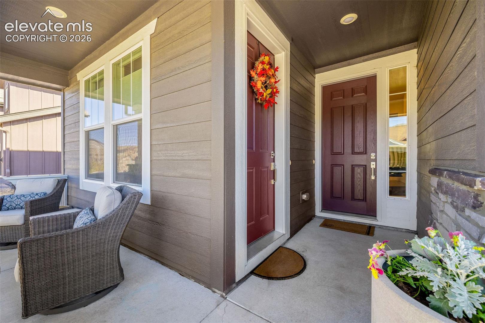 Covered front porch with 2 front entries