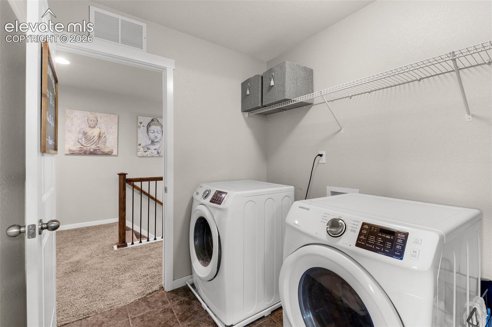 Utility area featuring tiled flooring and integrated wire shelving