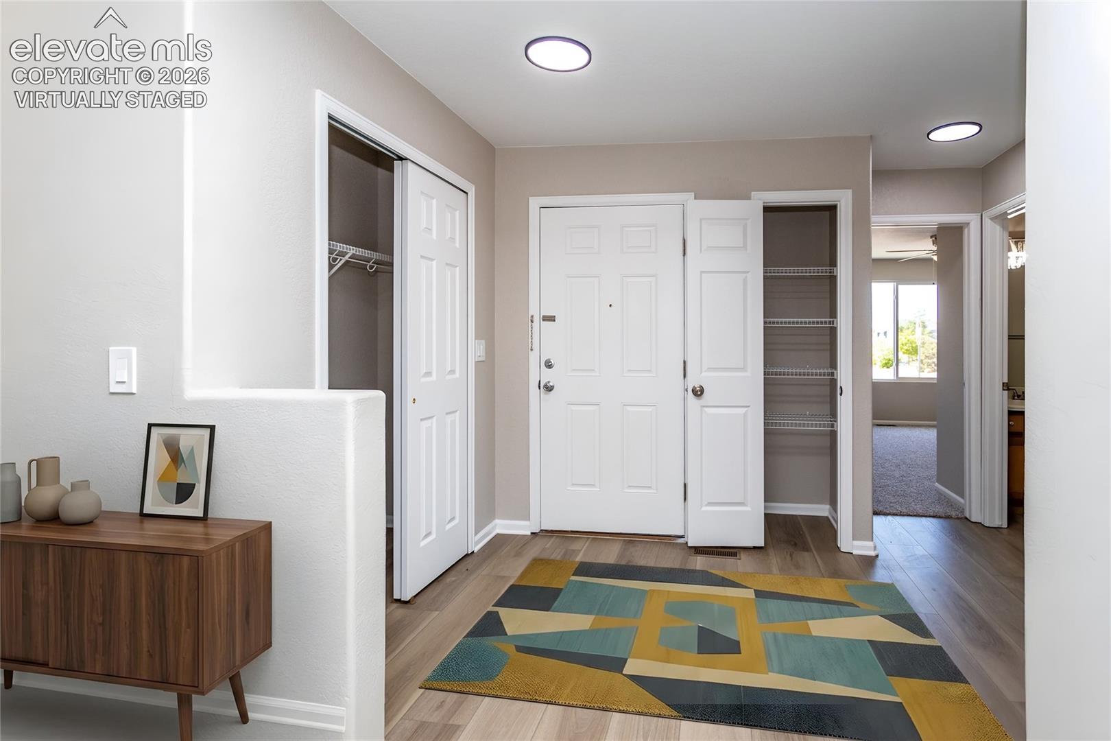 Virtually Staged Entrance Foyer - a welcoming space for family & friends!
