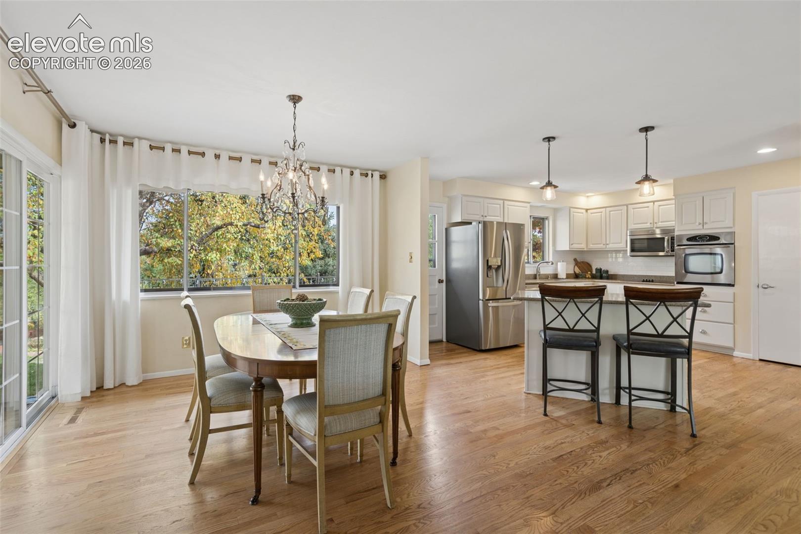 Hardwood floors throughout the main level. Dining room also walks out to a a covered patio. 