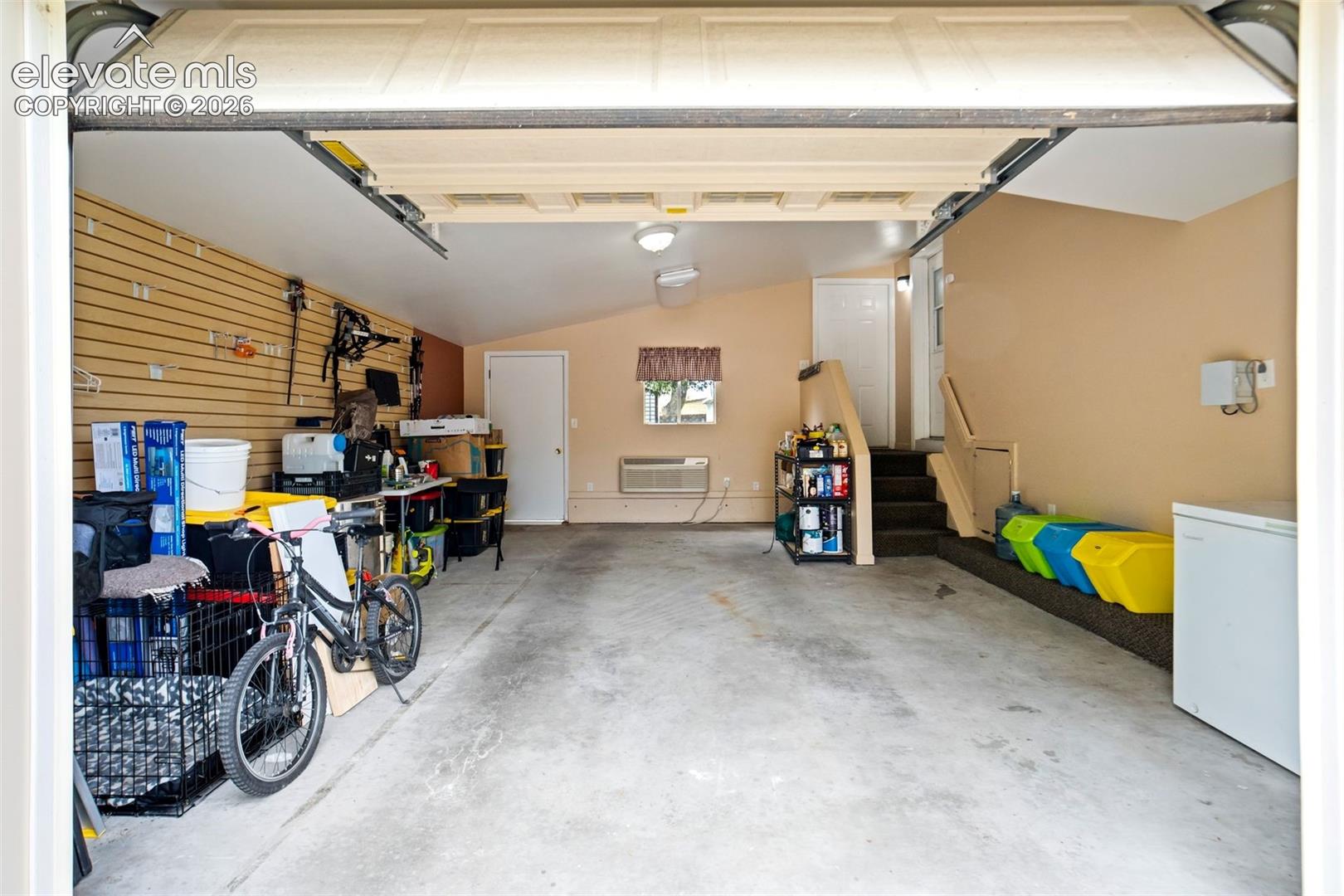 Convenient interior stair access from the garage into the home adds everyday functionality.