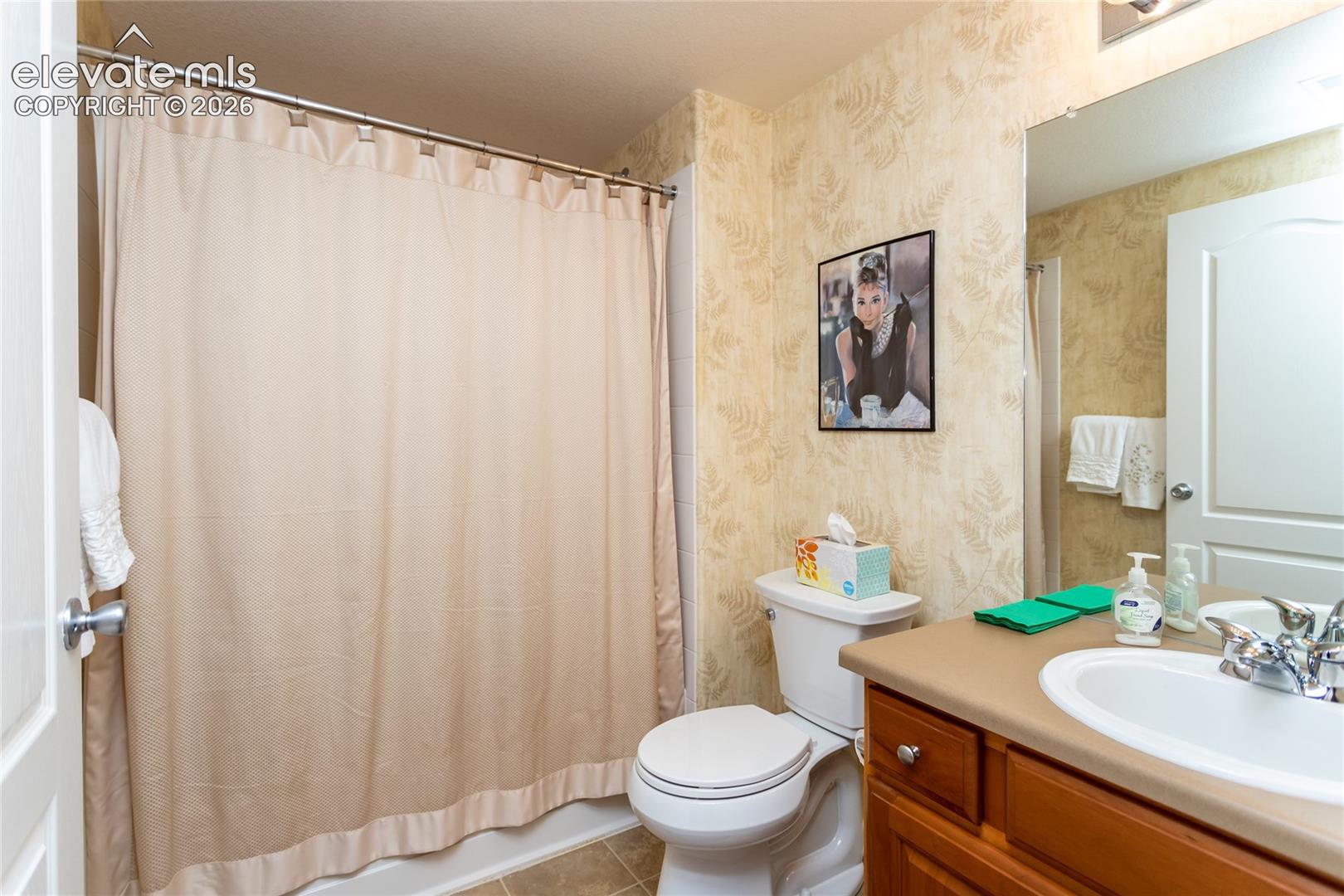 This bathroom has plenty of room & storage.