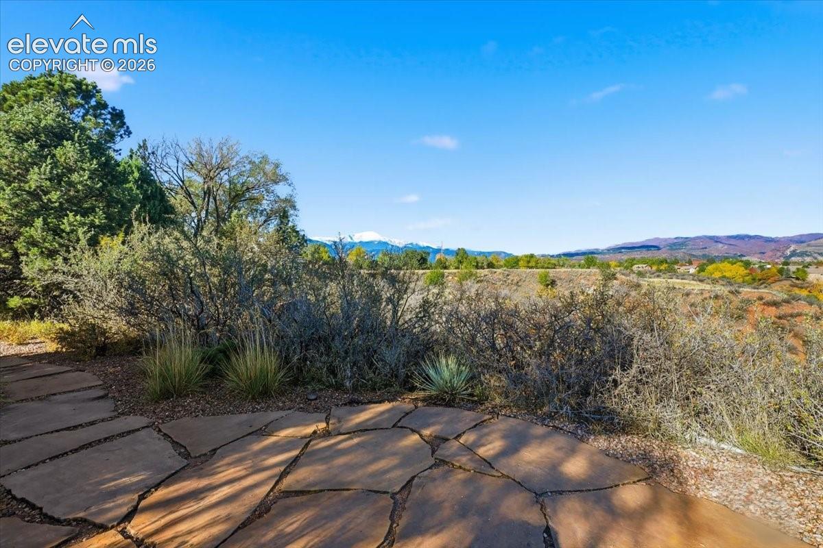 A stone path through the rear yard leads to to seceded patio with excellent views.  